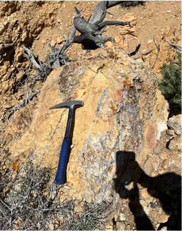 A hammer on a rock
Description automatically generated